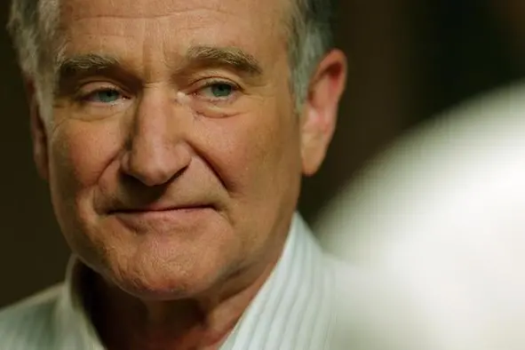 In this image released by Starz Digital, Robin Williams appears in a scene from the film, "Boulevard." In the film, Williams plays a closeted gay man who comes out in his 60s and then leaves his lifelong love, his wife of 40 years, played by Kathy Baker. (Starz Digital via AP)