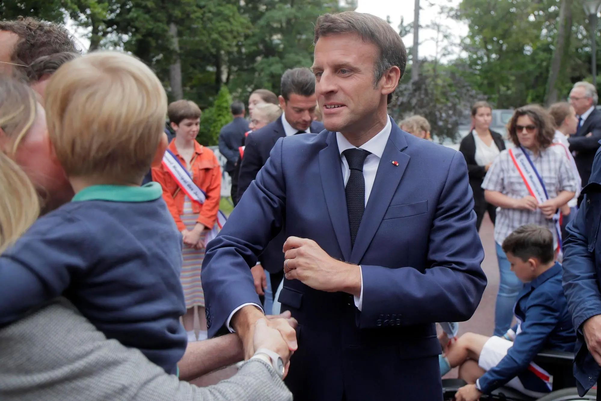 epa10021881 French President Emmanuel Macron cheers supporters before voting in Le Touquet, northern France, 19 June 2022. French voters are going to the polls in the final round of key parliamentary elections that will demonstrate how much legroom President Emmanuel Macron’s party will be given to implement his ambitious domestic agenda. EPA/Michel Spingler / POOL MAXPPP OUT