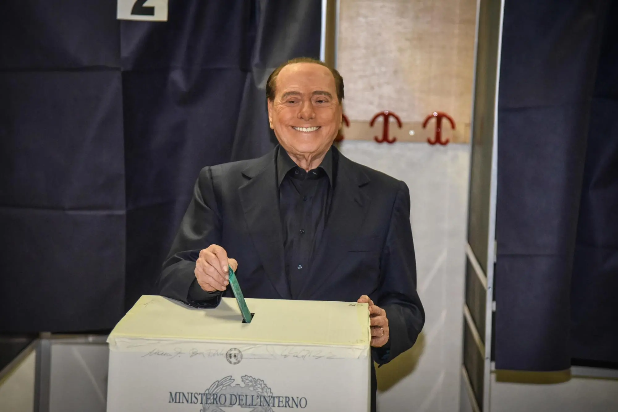 Berlusconi at the polling station for the vote in the Lombardy regional elections (Ansa)