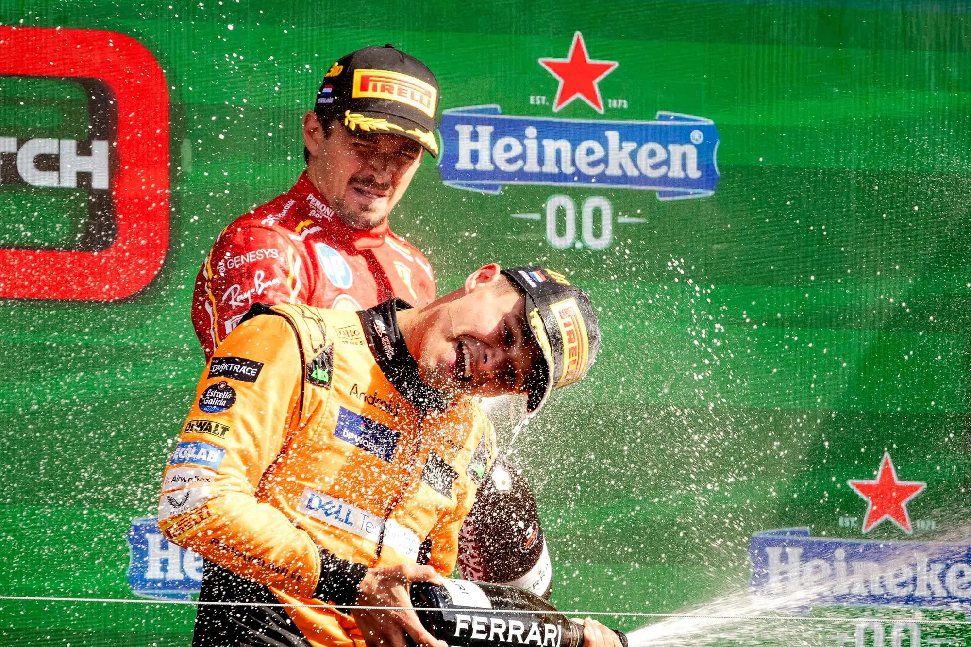 epa11564291 Third placed Charles Leclerc (Ferrari) and winner Lando Norris (McLaren) on the podium after F1 Grand Prix of the Netherlands in Zandvoort, the Netherlands, 25 August 2024. EPA/SEM VAN DER WAL