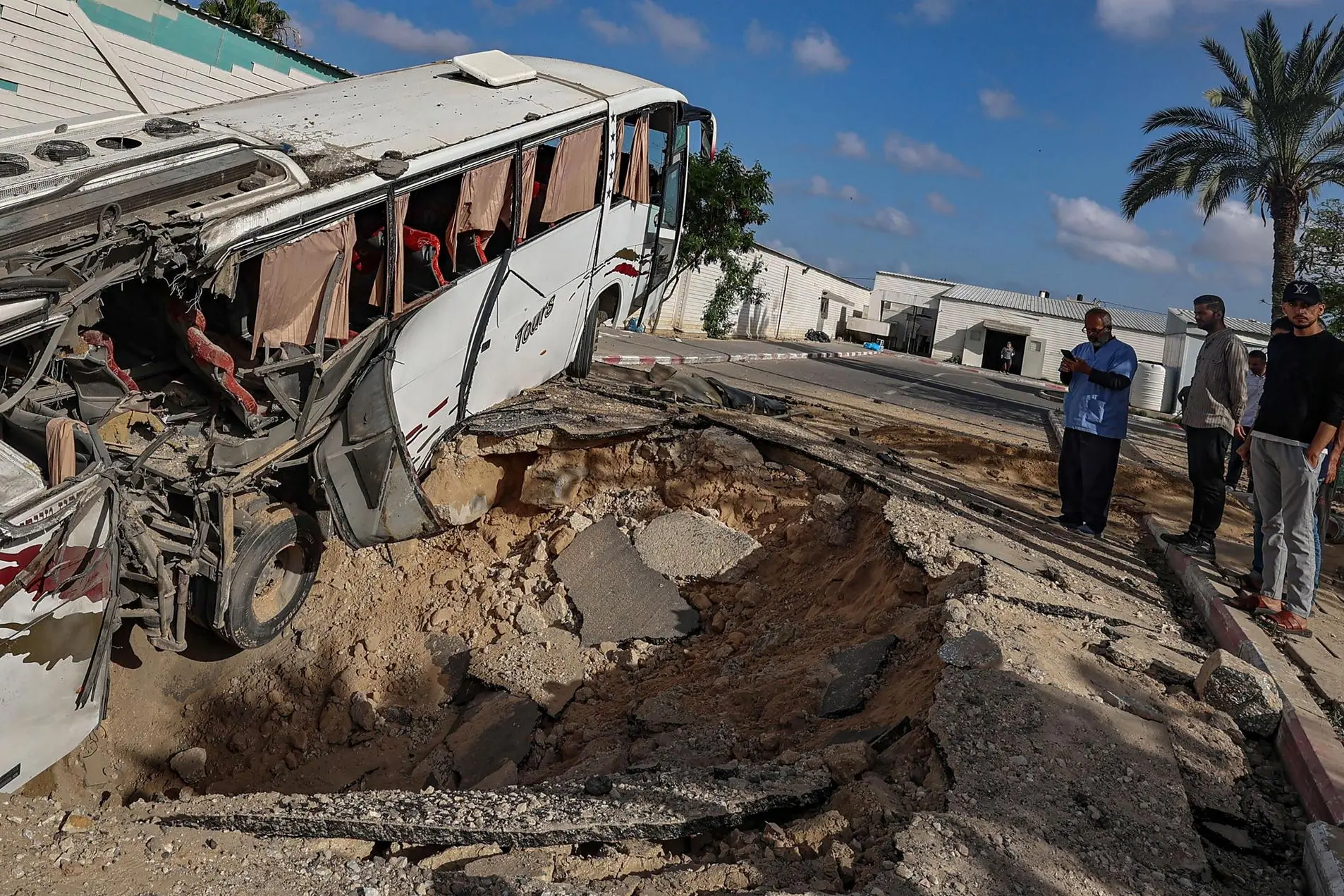 epa12099256 Palestinians inspect the site of an Israeli airstrike outside the European Hospital the previous day, in the east of Khan Younis, southern Gaza Strip, 14 May 2025. According to the Civil Defense in Gaza, at least 11 Palestinians were killed. More than 52,900 Palestinians have been killed in the Gaza Strip, according to the Palestinian Ministry of Health, since Israel launched a military campaign in the strip in response to a cross-border attack led by the Palestinian militant group Hamas on 07 October 2023, in which about 1,200 Israelis were killed and more than 250 taken hostage. EPA/MOHAMMED SABER