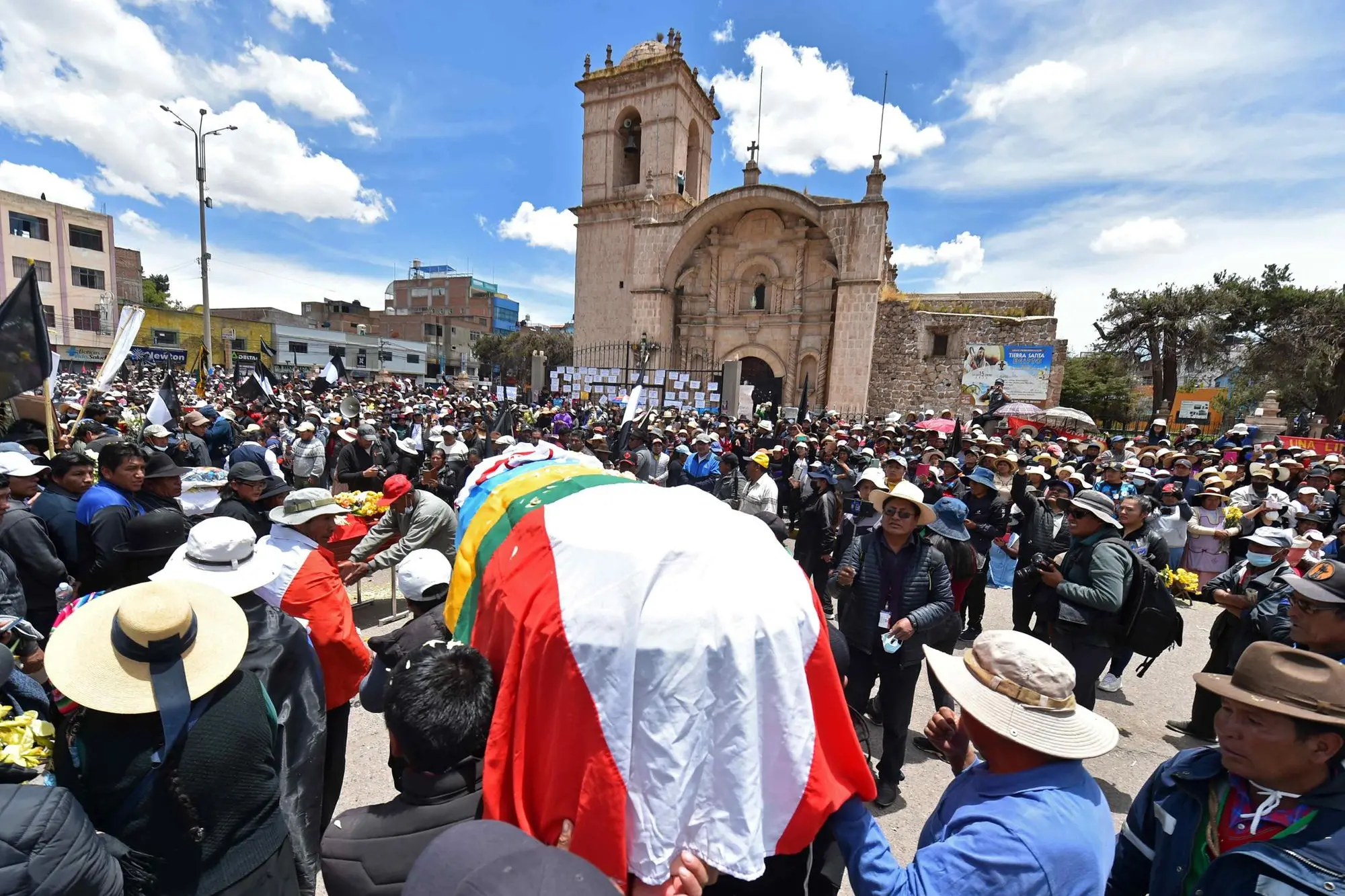 epa10400458 Dozens of people attend a large mass for those who died this week during the protests, in the Plaza de Armas in Juliaca, Peru, 11 January 2023. The political crisis in Peru continues to worsen after the events in Juliaca (south of the country), where at least 17 people died this Monday 09 January in anti-government protests near the local airport. The demonstrations in the interior of Peru, especially in the southern regions of the country, demand the resignation of Boluarte and the closure of Congress, as well as the call for general elections and a constituent assembly. EPA/Stringer