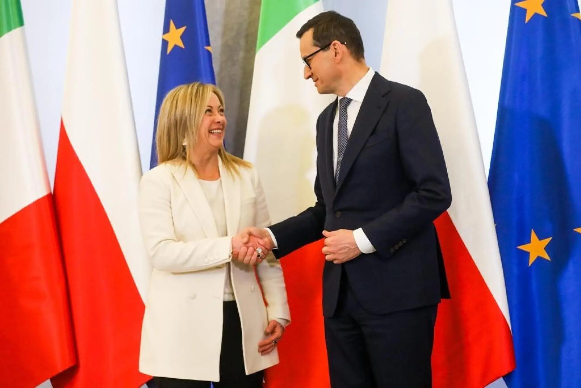 The handout picture provided by the Chigi Palace Press Office shows Polish Prime Minister Mateusz Morawiecki shaking hands with Italian Prime Minister Giorgia Meloni during an official welcoming ceremony in Warsaw, Poland, 20 February 2023. ANSA/ CHIGI PALACE PRESS OFFICE/ FILIPPO ATTILI +++ ANSA PROVIDES ACCESS TO THIS HANDOUT PHOTO TO BE USED SOLELY TO ILLUSTRATE NEWS REPORTING OR COMMENTARY ON THE FACTS OR EVENTS DEPICTED IN THIS IMAGE; NO ARCHIVING; NO LICENSING +++ NPK +++