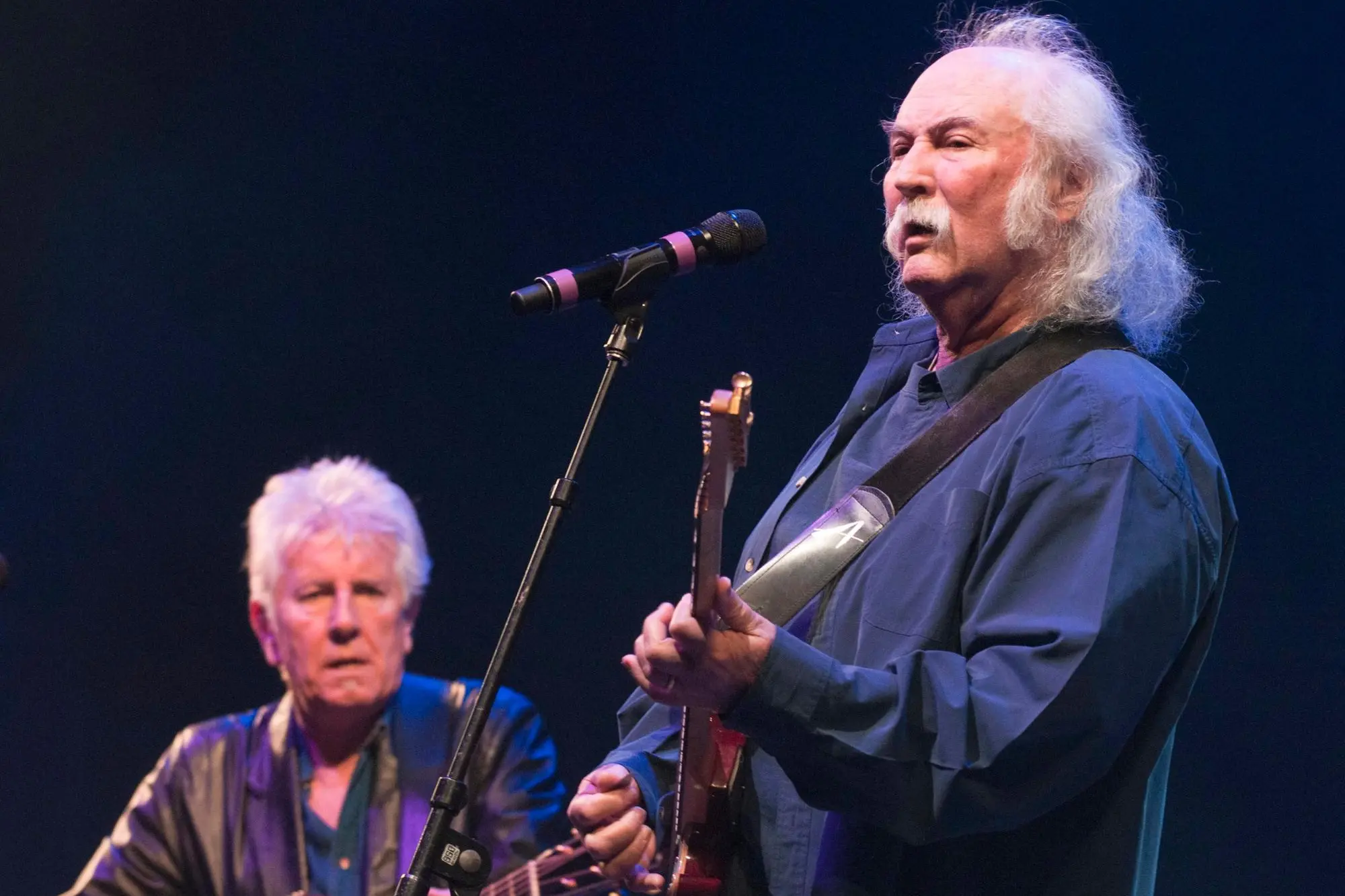 epa10416898 (FILE) - US musicians David Crosby (R) and Graham Nash (L) perform at a benefit concert in Tucson, USA, on 10 March 2011 (reissued 19 January 2023). Crosby, the singer-songwriter who cofounded The Byrds and Crosby, Stills & Nash, has died at the the age of 81 his publicist has confirmed. EPA/GARY WILLIAMS *** Local Caption *** 02627006