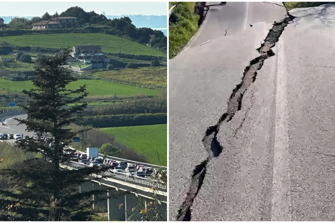 La frana e i danni con disagi al traffico (foto Ansa)