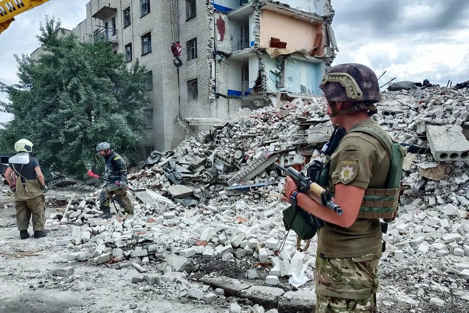 A handout photo made available by the National police press service on 10 July 2022 shows Ukrainian rescuers clean the debris of a residential building after shelling in Chasiv Yar, Ukraine, 10 July 2022. At least 15 people were killed and five injured as a result of the Russian rocket fire on 09 July, the State Emergency Services said. Russian troops on 24 February entered Ukrainian territory, starting a conflict that has provoked destruction and a humanitarian crisis. ANSA/National police press service / HANDOUT HANDOUT EDITORIAL USE ONLY/NO SALES