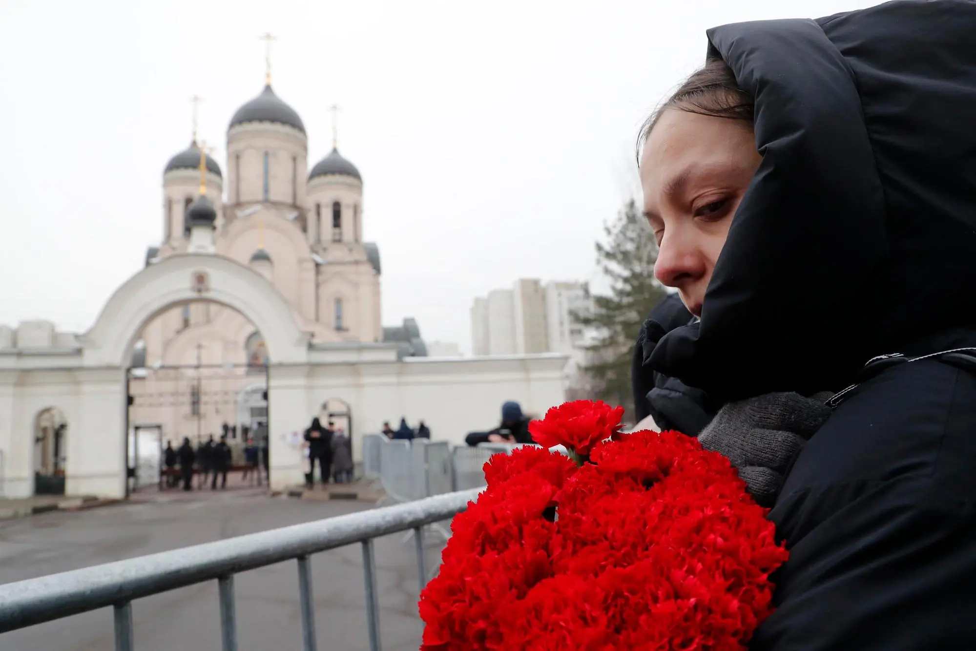 epaselect epa11190122 People react outside the Church of the Icon of the Mother of God, ahead of the upcoming funeral of late Russian opposition leader Alexei Navalny, in Moscow, Russia, 01 March 2024. Navalny’s funeral will be held at 14:00 local time on 01 March 2024, according to his press-secretary. Outspoken Kremlin critic Navalny died aged 47 in an arctic penal colony on 16 February 2024 after being transferred there in 2023. The colony is considered to be one of the world’s harshest prisons EPA/MAXIM SHIPENKOV