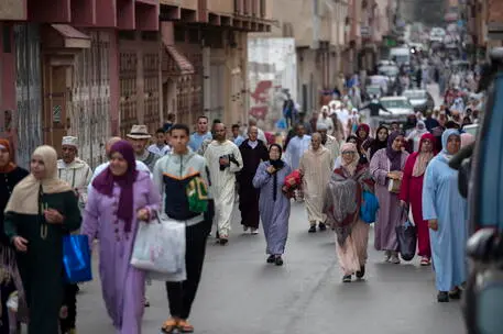 epa10585364 Muslims walk on their way to attend Eid al-Fitr prayers marking the end of the holy month of Ramadan, at an open square in Sale, Morocco, 22 April 2023. Muslims around the world celebrate Eid al-Fitr, the three days festival marking the end of Ramadan. Eid al-Fitr is one of the two major holidays in the Islamic calendar. EPA/JALAL MORCHIDI