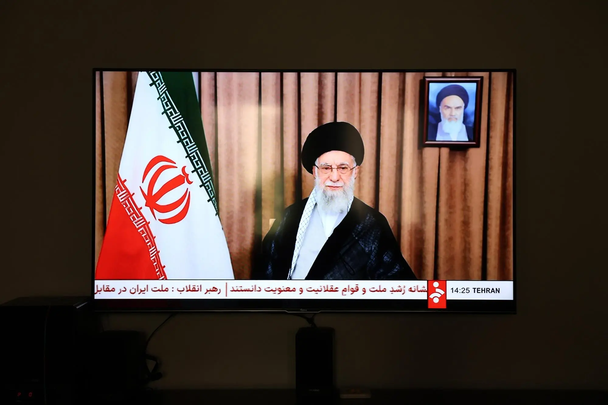 epa12183099 Iranian state television (IRIB) broadcast a message from Iran's Supreme Leader Ayatollah Ali Khamenei to the nation, in Tehran, Iran, 18 June 2025. The supreme leader stated that Iran will not accept US calls for an unconditional surrender, as the Iran-Israel conflict entered its sixth day. Israel has been conducting strikes across Iran since 13 June, targeting nuclear, military, and energy facilities, prompting Iran to launch retaliatory waves of missiles and drones toward Israel. EPA/ABEDIN TAHERKENAREH