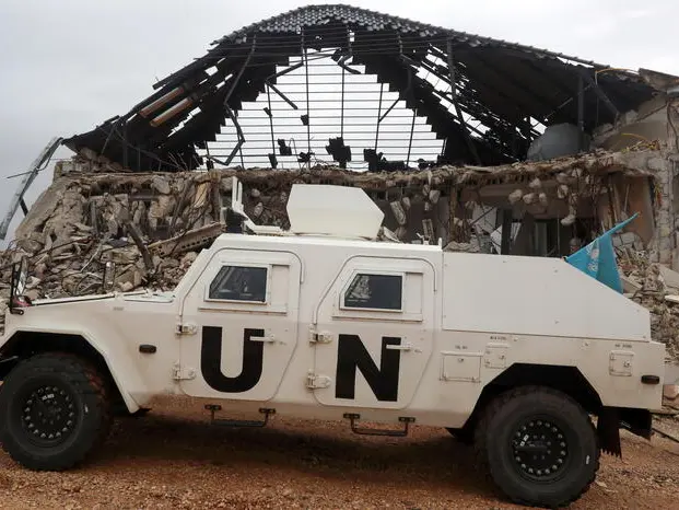 epa12578782 An armoured vehicle of the United Nations Interim Force in Lebanon (UNIFIL) drives next to a destroyed house in the village of Blida, near the border with northern Israel, southern Lebanon, 08 December 2025. The UN Security Council in August voted unanimously to extend for a final time the mandate of UNIFIL until 31 December 2026, after which will start an orderly and safe drawdown and withdrawal within one year. EPA/WAEL HAMZEH