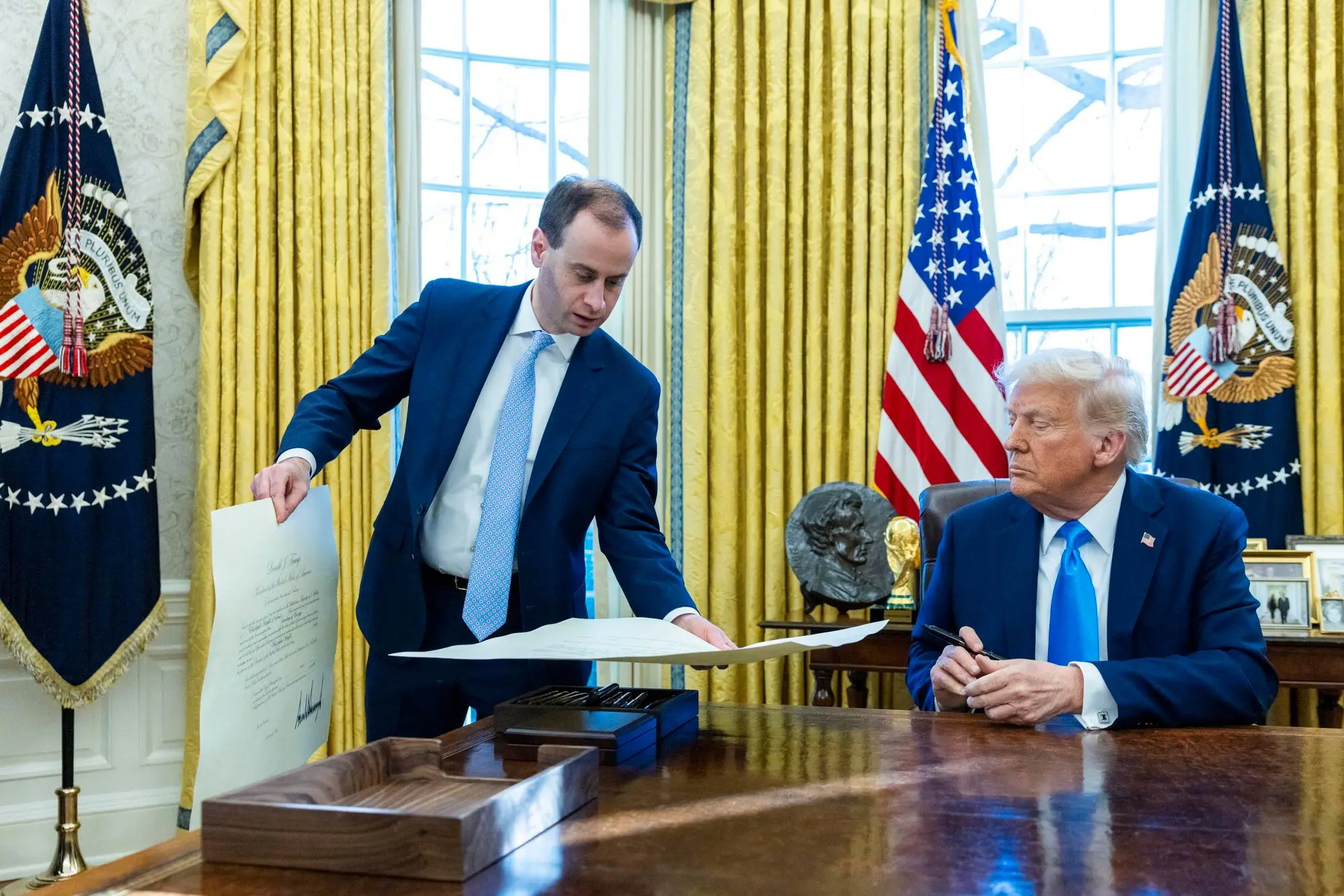 epa11875368 US President Donald Trump looks on during a signing ceremony in the Oval Office of the White House in Washington, DC, USA, 04 February 2025. EPA/SHAWN THEW / POOL