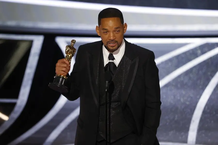 (FILE) - Us actor Will Smith reacts after winning the Oscar for Best Actor for 'King Richard' during the 94th annual Academy Awards ceremony at the Dolby Theatre in Hollywood, Los Angeles, California, USA, 27 March 2022 (reissued 08 April 2022). The Academy of Motion Pictures Arts and Sciences' Board of Governors decided on 08 April 2022 to ban Will Smith from attending all its events, including the Academy Awards, for ten years after the Best Actor winner slapped presenter Chris Rock on stage during the 94th Oscars ceremony. Smith had slapped US comedian Rock over an assumed verbal insult of Smith's wife, US actress Jada Pinkett Smith. ANSA/ETIENNE LAURENT