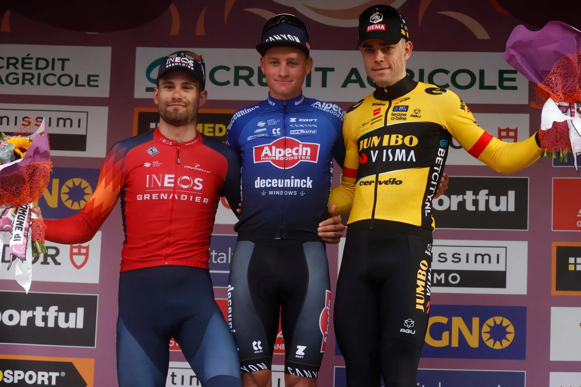 Il podio della Milano-Sanremo: da sinistra Filippo Ganna (2°). Mathieu Van Der Poel e Wout Van Aert (3°) (Ansa)