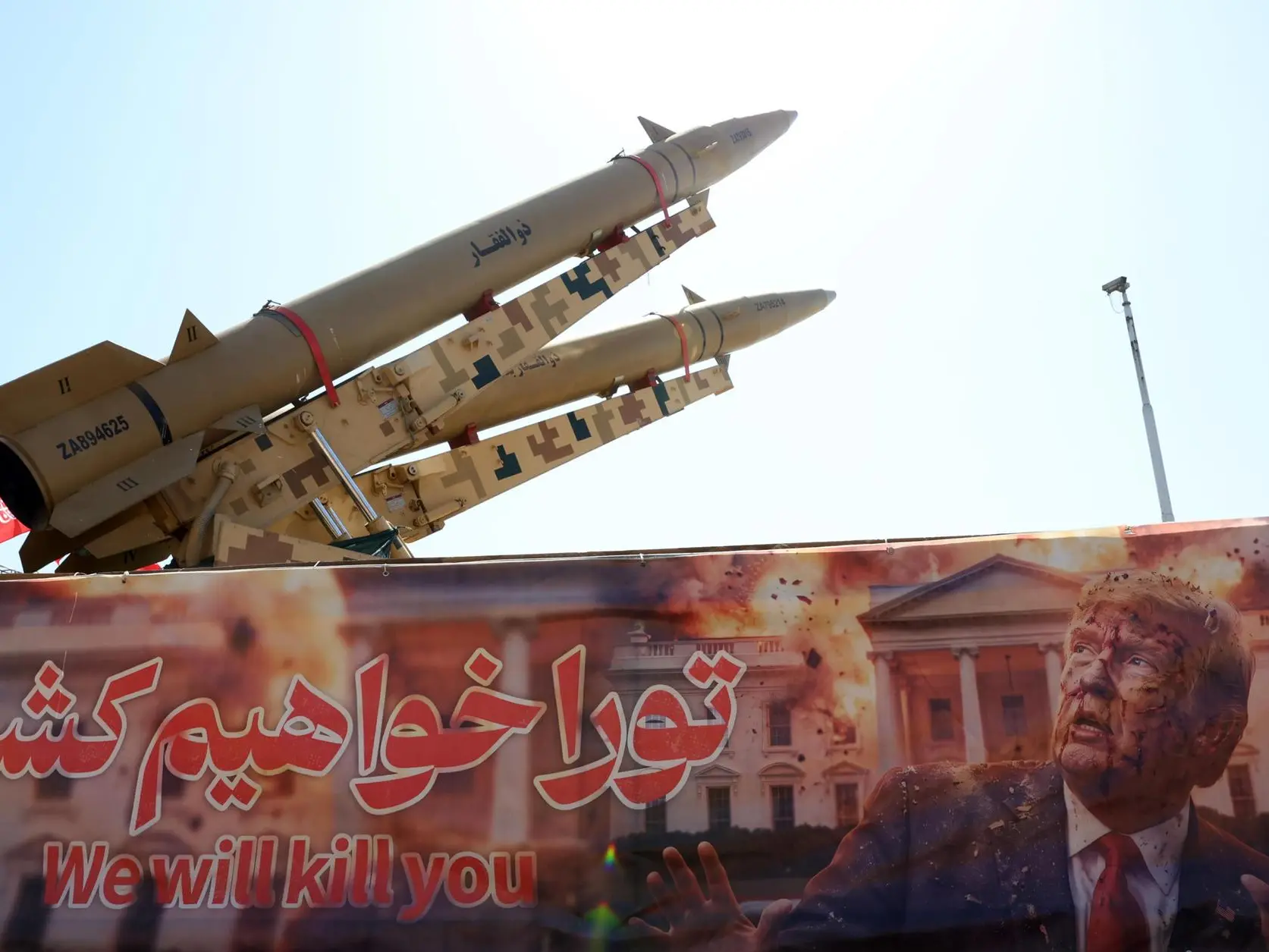 Ормузский пролив: столкновение США и ОАЭ на Сардинии epa13141735 Iranian missiles 'Zolfaghar' are on display above a banner depicting US President Trump at Azadi Square in Tehran, Iran, 30 July 2026. The US completed a 'heavy wave of strikes' against dozens of Islamic Revolutionary Guard Corps (IRGC) targets in Iran on 29 July 2026 in response to Tehran's attempted missile attacks on US forces based in the Middle East a day earlier, according to the US Central Command (CENTCOM). EPA/ABEDIN TAHERKENAREH RESTRICTIONS: NO Access Israel Media/Persian Language TV Stations Outside Iran/Strictly No Access BBC Persian/VOA Persian/Manoto TV/Iran International TV. (As mandated by Iran's Directorate General for Foreign Media)