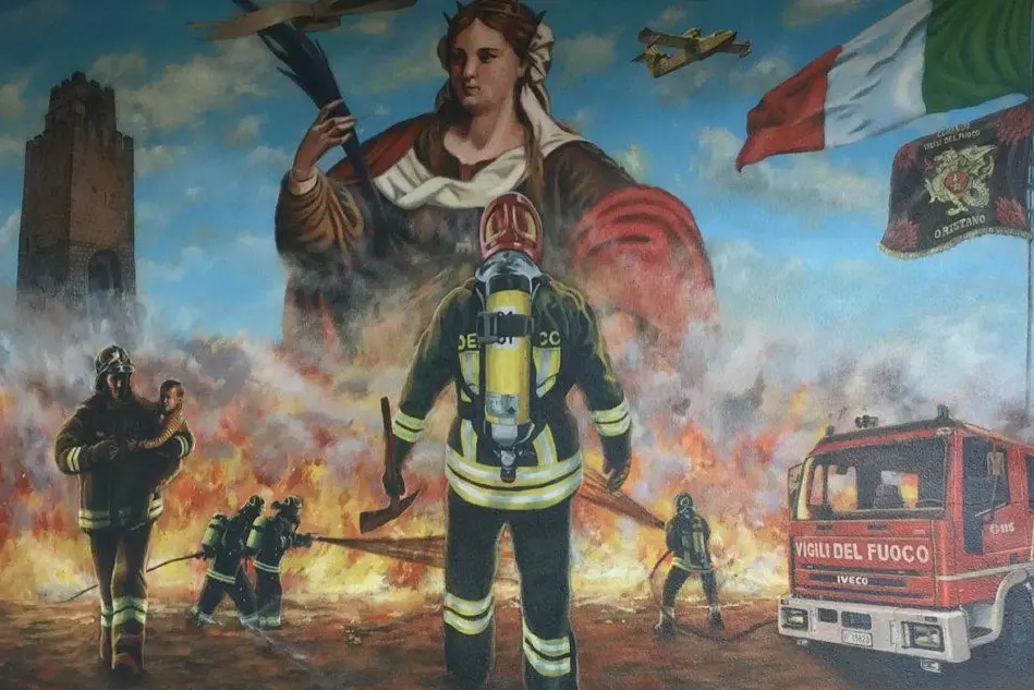 Il murales davanti alla caserma (foto Elia Sanna)