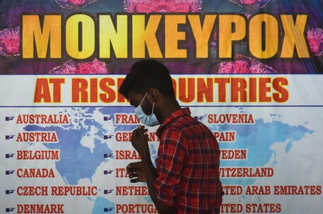 epa10074095 An Indian health worker walks in front of a list of high-risk countries for the Monkeypox virus, as India reported the first case of Monkeypox in the WHO South-East Asia Region, at Chennai International Airport, in Chennai, India, 16 July 2022. The Tamil Nadu state public health department has started screening international passengers landing in the state of Tamil Nadu for symptoms of the MonkeypoxÂ virus as the first confirmed case of WHO South-East Asia Region has been reported in India after a traveler from Kerala who recently returned from the Middle East tested positive for the Monkeypox virus on 14 July 2022. The Tamil Nadu state government has increased the surveillanceÂ across the borders sharing with the state of Kerala and started screening at all international airports in Tamil Nadu. EPA/IDREES MOHAMMED