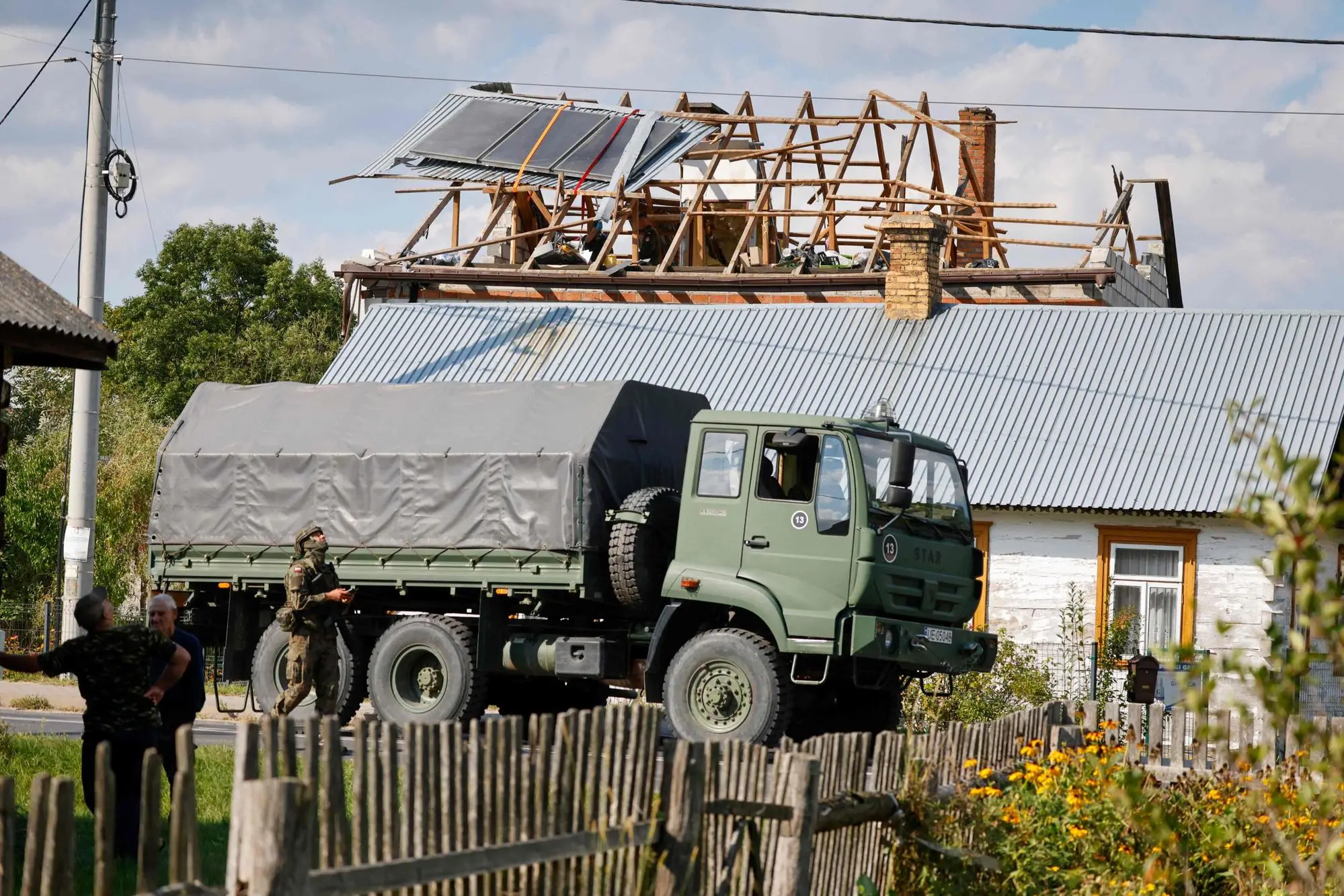 Police and army inspect damage to a house destroyed by debris from a shot down Russian drone in the village of Wyryki-Wola, eastern Poland, on September 10, 2025. NATO air defences helped counter drones that entered Polish airspace overnight and alliance chief Mark Rutte is in contact with Warsaw, a NATO spokeswoman said Wednesday. Polish Prime Minister Donald Tusk said Wednesday that a violation of Polish airspace by several Russian drones overnight was a major provocation aimed at the EU and NATO member. (Photo by Wojtek RADWANSKI / AFP)