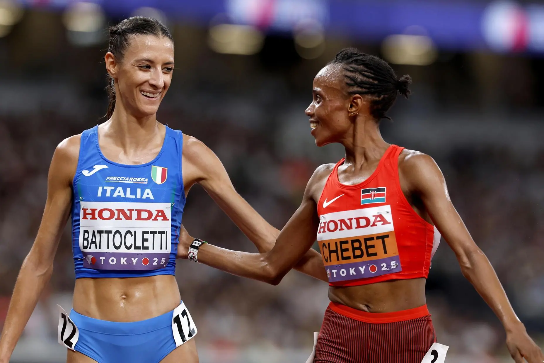 epa12386683 Beatrice Chebet of Kenya and Nadia Battocletti of Italy congratulate each other after their race in the Women's 5000m heats at the World Athletics Championships 2025 in Tokyo, Japan, 18 September 2025. EPA/FRANCK ROBICHON