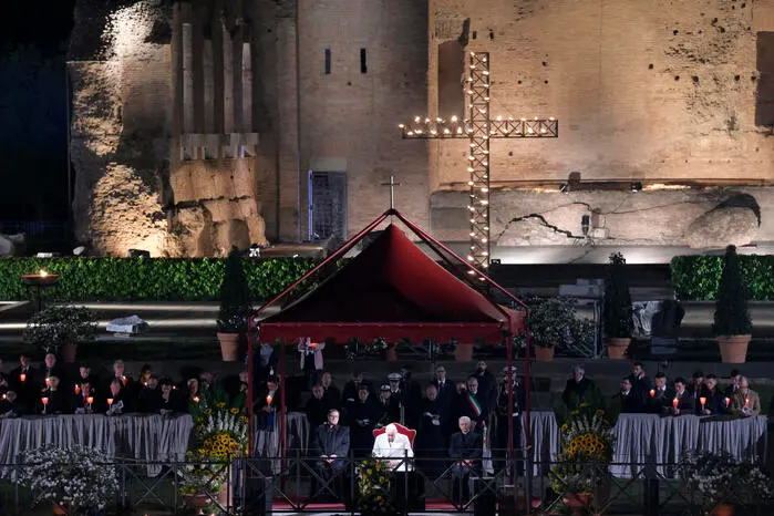 Pope Francis presides over the Via Crucis - Way of the Cross - torchlight procession on the Good Friday, in front of the ancient Colosseum in Rome, 15 April 2022. ANSA/CLAUDIO PERI