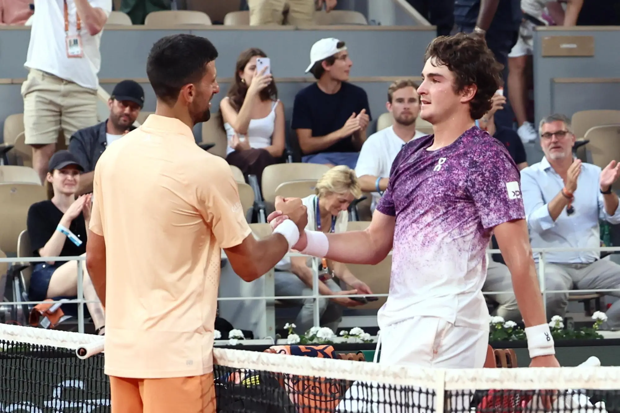 Novak Djokovic e Joao Fonseca (Ansa)