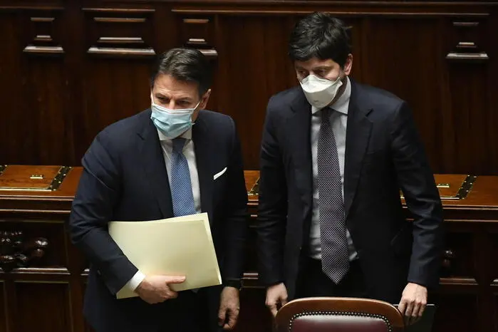 Italian Prime Minister Giuseppe Conte (L) with Italian Health Minister, Roberto Speranza (R), in the Lower House of the Parliament in Rome, Italy, 18 January 2021. ANSA/ETTORE FERRARI / POOL
