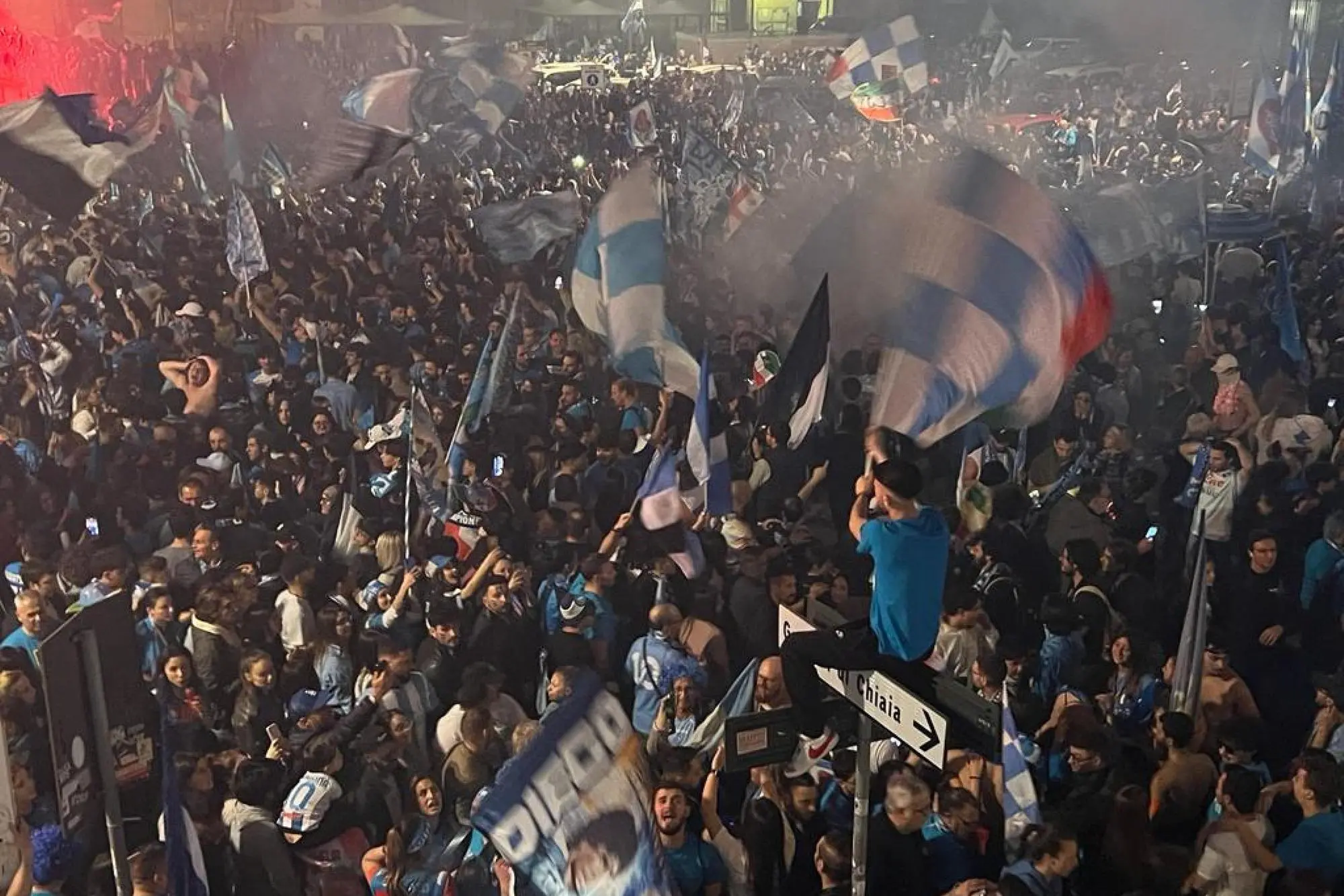 SSC Napoli’s supporters celebrate the victory of the Italian Serie A Championship (Scudetto) at the end of the match against Udinese Calcio in the centre of Naples, Italy, 04 May 2023. ANSA/CIRO FUSCO