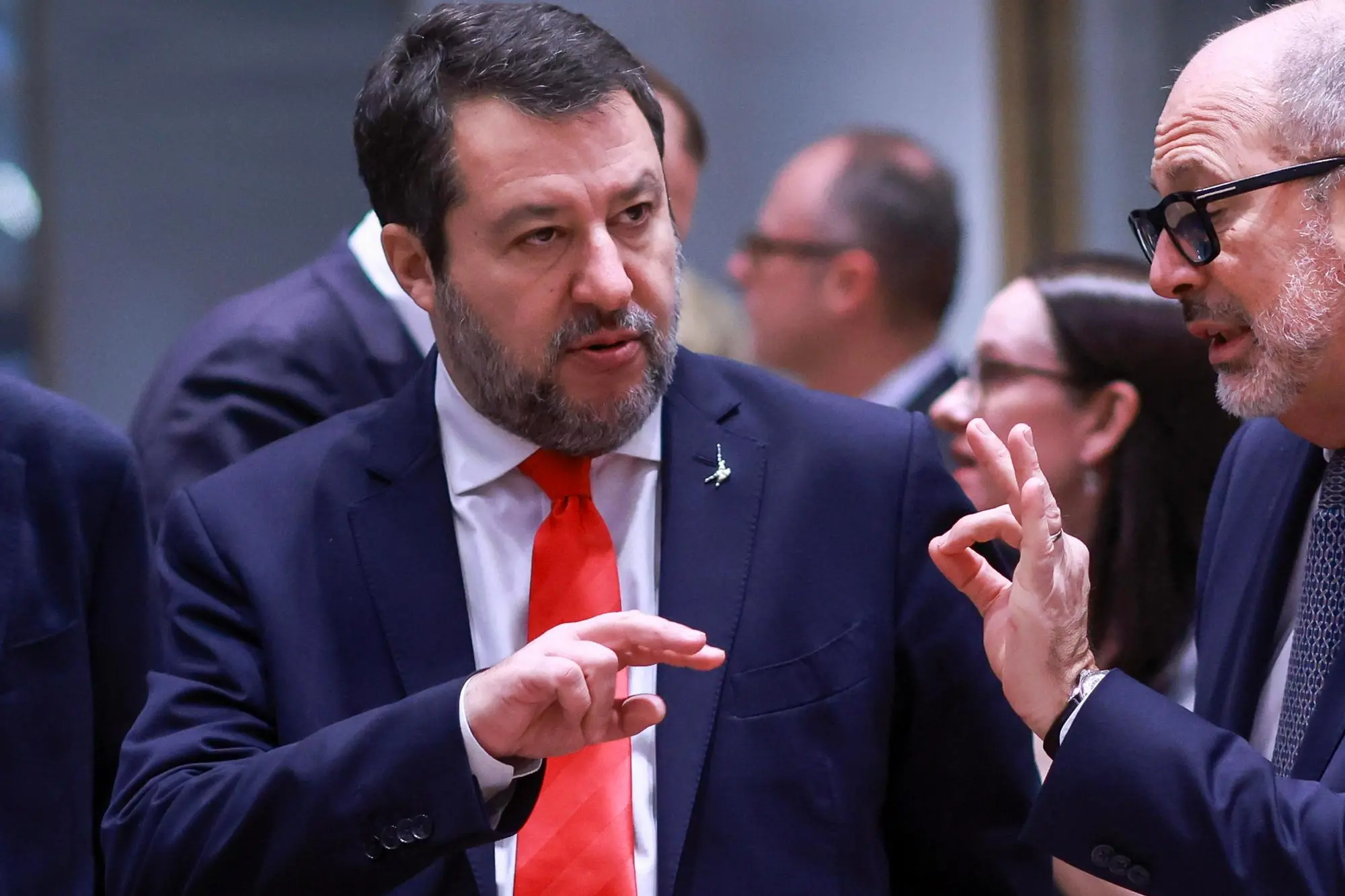 epa11758223 Italian Deputy Prime Minister and Minister of Infrastructure and Transport Matteo Salvini (L) gestures as he attends the EU Transport Ministers Council in Brussels, Belgium, 05 December 2024. The European Transport, Telecommunications and Energy Council runs from 05 until 06 December. EPA/OLIVIER HOSLET