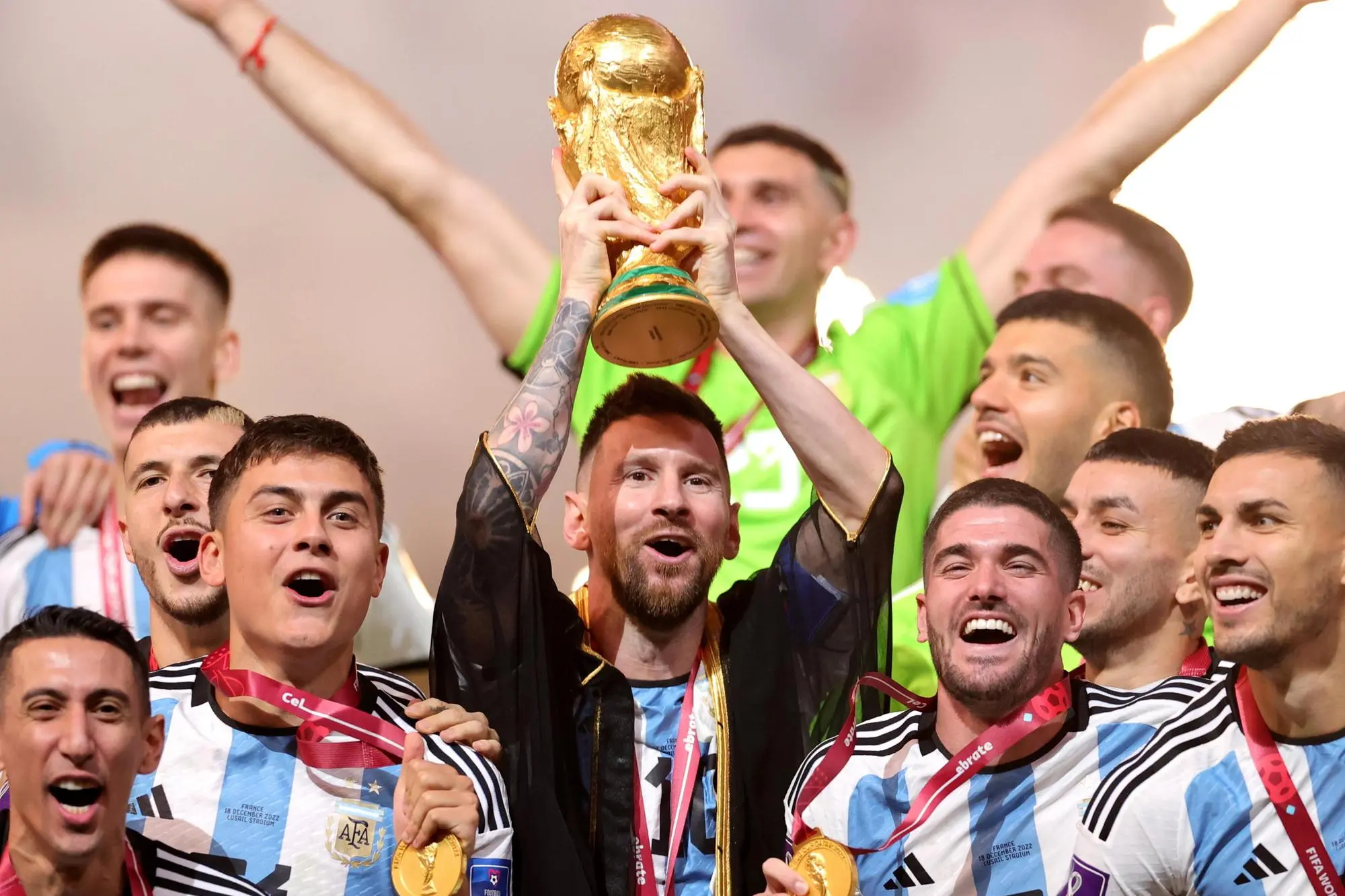 epa10373014 Lionel Messi of Argentina lifts the trophy after Argentina won the FIFA World Cup 2022 Final between Argentina and France at Lusail stadium, Lusail, Qatar, 18 December 2022. EPA/Friedemann Vogel