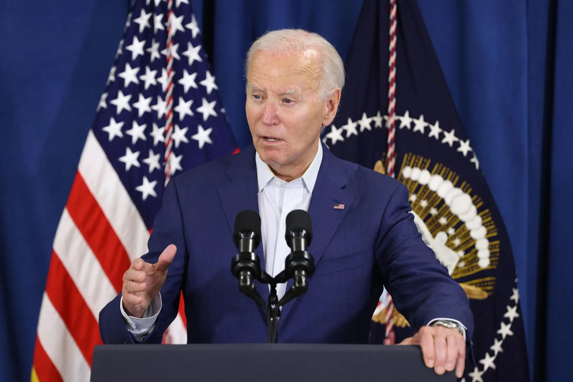 TOPSHOT - US President Joe Biden speaks after his Republican opponent Donald Trump was injured following a shooting at an election rally in Pennsylvania, at the Rehoboth Beach Police Department, in Rehoboth Beach, Delaware, July 13, 2024. US President Joe Biden led the condemnation after his election rival Donald Trump was wounded in a shooting incident at a rally in Pennsylvania July 13 that also reportedly killed at least one bystander. Political leaders on both sides of the aisle slammed the violence minutes after the Republican candidate was rushed off stage by the Secret Service, blood running down his face. (Photo by SAMUEL CORUM / AFP)