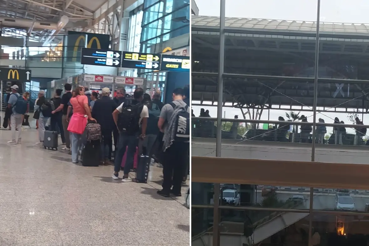 La fila dei passeggeri a Elmas