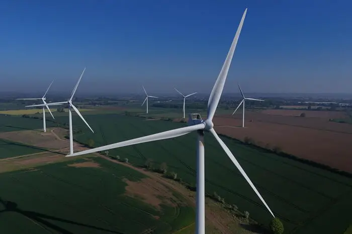 epa12066671 An image made with a drone shows an onshore wind farm in Biggleswade, Britain, 01 May 2025. The UK Environment Secretary Steve Reed said transitioning to a green economy was necessary for the UK to take back 'control of our own energy supply' especially in light of Russia's ongoing invasion of Ukraine. EPA/NEIL HALL