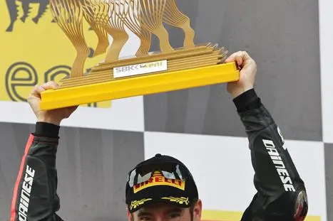 Italian rider of Aprilia, Max Biaggi, celebrates on the podium after winning for half a point the 2012 Superbike World Championship, Magny Cours, France, 7 October 2012. ANSA/FABRIZIO PORROZZI/UFFICIO STAMPA +++ NO SALES, EDITORIAL USE ONLY +++