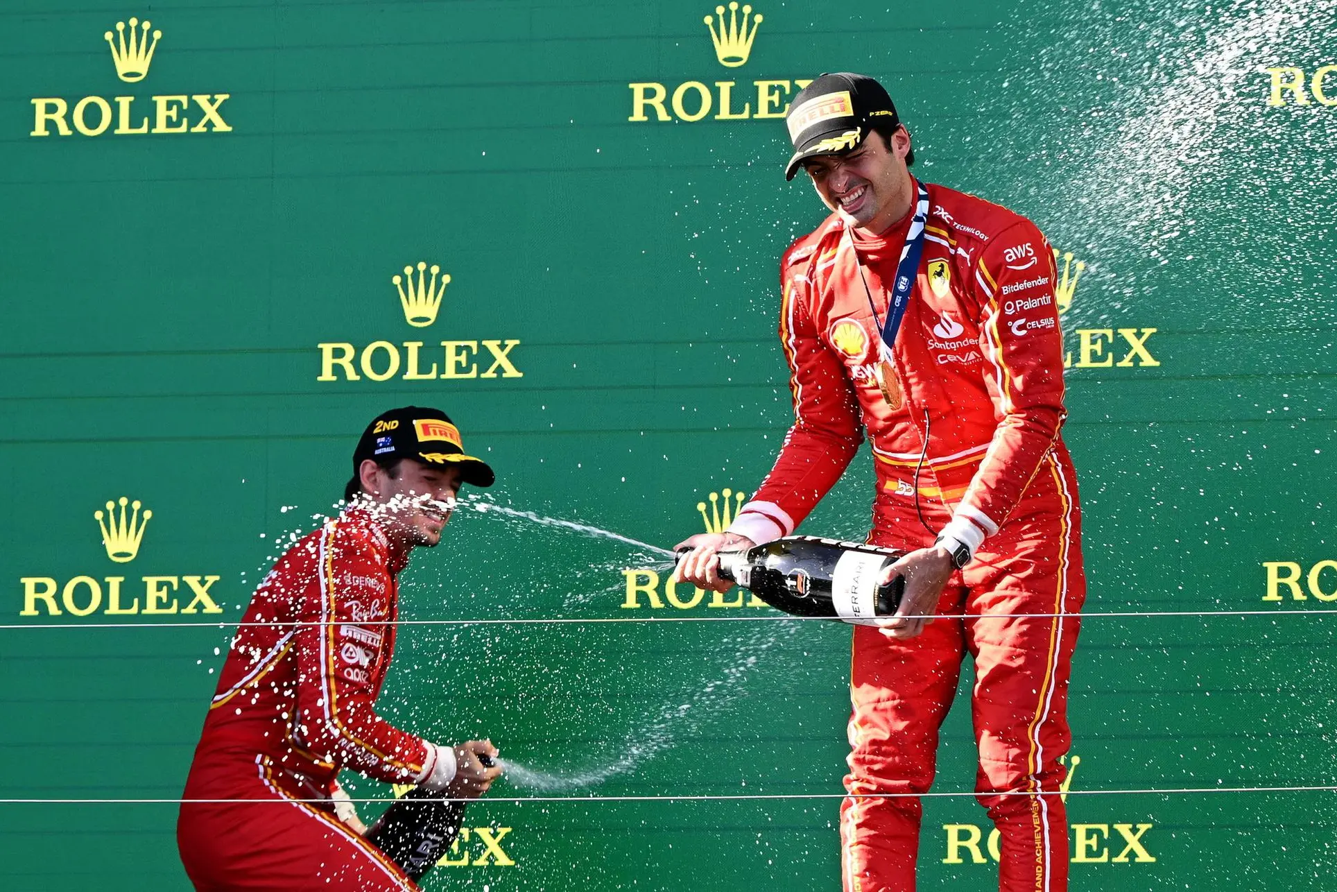 Charles Leclerc e Carlos Sainz sul podio del Gp d'Australia (foto Ansa/Epa)