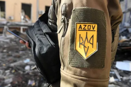 epa09842897 A Ukrainian soldier of Azov Battalion in Kharkiv, Ukraine, 22 March 2022. Russian troops entered Ukraine on 24 February resulting in fighting and destruction in the country, and triggering a series of severe economic sanctions on Russia by Western countries. EPA/ANDRZEJ LANGE POLAND OUT