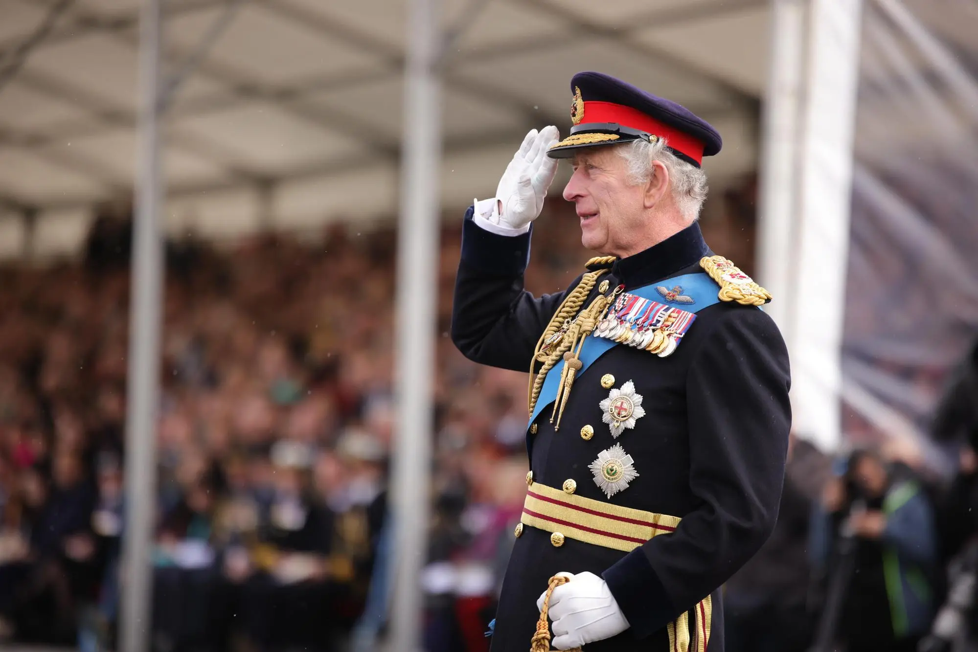 epa10572354 A handout picture provided by the British Ministry of Defence (MoD) shows his Majesty, King Charles III, saluting to staff and cadets at the Royal Military Academy in Sandhurst, Britain, 14 April 2023. The Sovereign's visit to Sandhurst marked the 200th anniversary of the Academy’s Commissioning Parade, and included the 40,000th Officer Cadet to pass out from the academy since 1947. His Majesty the King also presented new colours for the academy, bearing the new cypher of HM King Charles III. They represented the first set of military colours to be presented to the British Army bearing the new Sovereign's 'CRIII' cypher. EPA/Sgt Donald C Todd/MoD/HANDOUT MANDATORY CREDIT: MOD/CROWN COPYRIGHT HANDOUT EDITORIAL USE ONLY/NO SALES