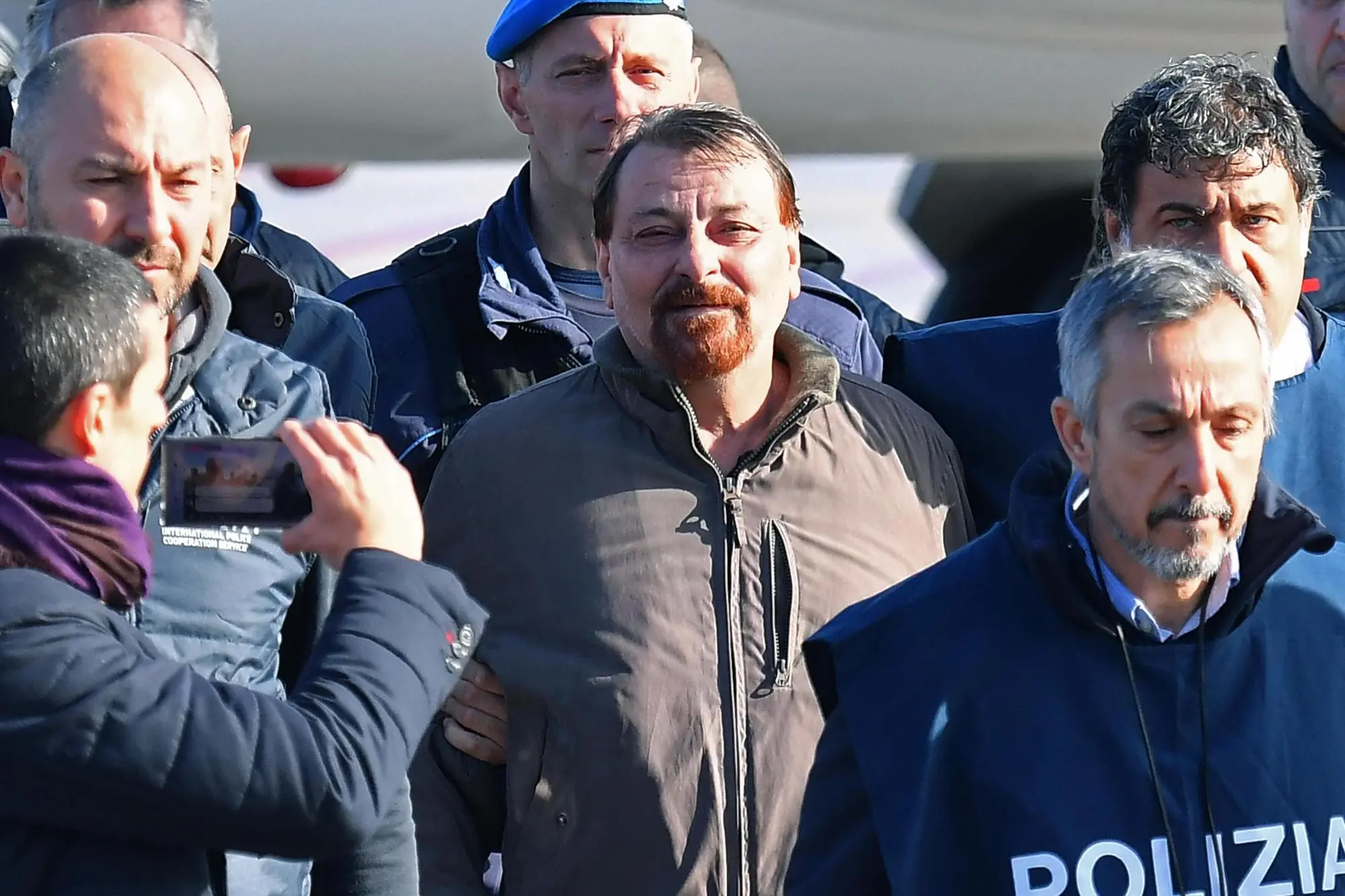 Former far-left militant Cesare Battisti arrives escorted by Italian police at Rome's Ciampino airport, Italy, 14 January 2019. Cesare Battisti, 64, a former member of the far-left terrorist group Armed Proletarians for Communism (PAC), was arrested in Bolivia after 38-years as a fugitive of the Italian justice. He is set to serve a life sentence for four murders committed in Italy's 'years of lead' of political violence in the 1970s and 1980s, media reported. ANSA/ETTORE FERRARI