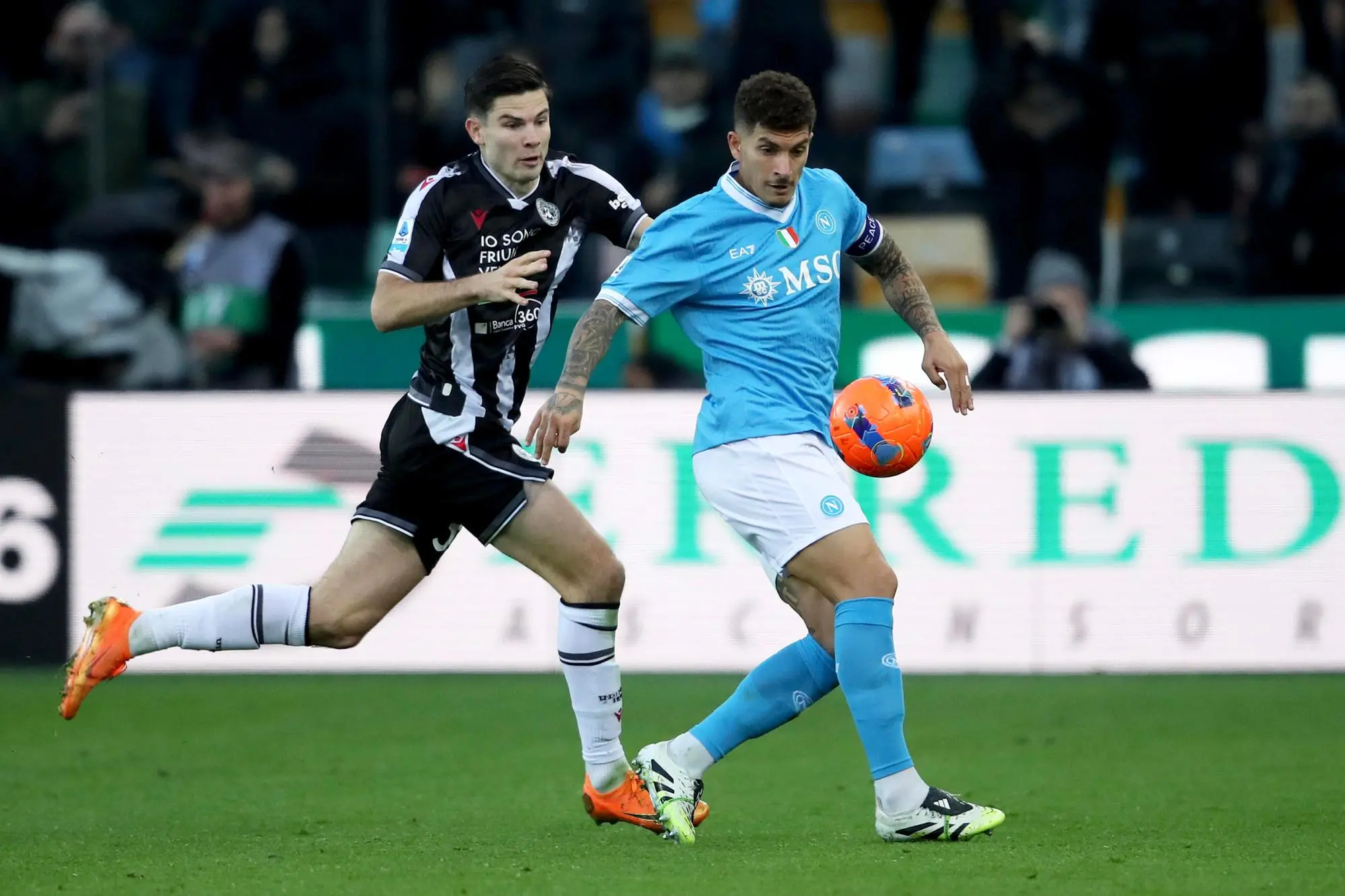 Udinese's Jurgen Ekkelenkamp (L) and Napoli's Giovanni Di Lorenzo in action during the Italian Serie A soccer match Udinese Calcio vs SSC Napoli at the Friuli - Bluenergy Stadium in Udine, Italy, 14 December 2025. ANSA / GABRIELE MENIS