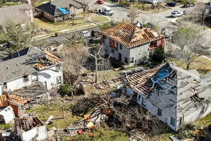 epaselect epa09842670 An aerial photo made with a drone shows damaged homes after a series of tornadoes passed through Round Rock, Texas, USA, 22 March 2022. Heavy thunderstorms passed through central Texas prompting tornado watches and warnings in the area on 21 March. EPA/TANNEN MAURY