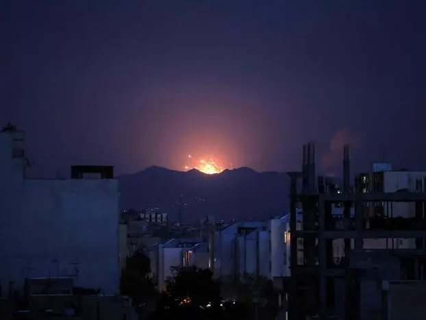 The sky is lit up at the site of an airstrikes in a central area of the Iranian capital Tehran on March 6, 2026. Fresh strikes rocked Iran and Lebanon on March 6 as Israel and the United States stepped up their attacks in the sprawling Middle East war, with powerful explosions shattering the skies of Tehran. The war, now in its seventh day, has dragged in global powers, upended the world's energy and transport sectors, and brought chaos to even usually peaceful areas of the volatile region. (Photo by ATTA KENARE / AFP)