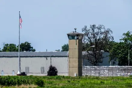 epa08546068 Heat waves cause distortion of a guard tower, razor wire fencing and building at the US Penitentiary complex where the federal execution chamber is located in Terre Haute, Indiana, USA, 14 July 2020. After several holds placed by federal judges, Daniel Lewis Lee was put to death by lethal injection for murdering three family members including an eight year old girl in 1996. According to reports he was pronounced dead at 8:07 AM Eastern Daylight Time. Three more executions are scheduled for 15 July, 17 July and 28 August as the US Justice Department resumes executions after more than 17 years. EPA/TANNEN MAURY