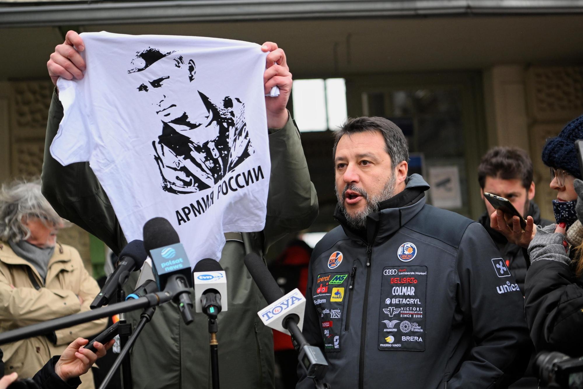 Mayor of Przemysl Wojciech Bakun shows a t-shirt with putin's Portrait and slogan 'Russian Army' during a press conference with Former Deputy Prime Minister of Italy, and Lega leader Matteo Salvini (R) in front of the Main Railway Station in Przemysl, Poland 08 March 2022. Mayor Bakun unsuccessfully tried to hand Matteo Salvini a T-shirt with an image of Vladimir Putin, similar to one Salvini was posing with at Kremlin during a visit to Moscow and asked the italian senator to wear it during a visit to refugees reception center close to the border with Ukraine. ANSA/DAREK DELMANOWICZ POLAND OUT