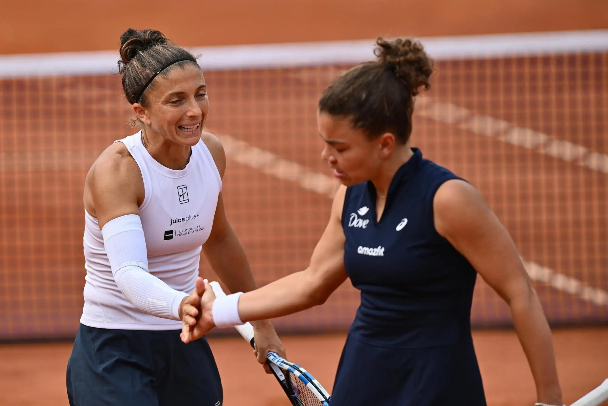 Sara Errani (ITA) and Jasmine Paolini (ITA) in action against Coco Gauff (USA) and Alex Eala (PHL) during their match at the Italian Open tennis tournament at Foro Italico sports complex, in Rome, Italy, 14 May 2025. The Italian Open tennis tournament is held between 07 and 18 May 2025. ANSA/Domenico Cippitelli