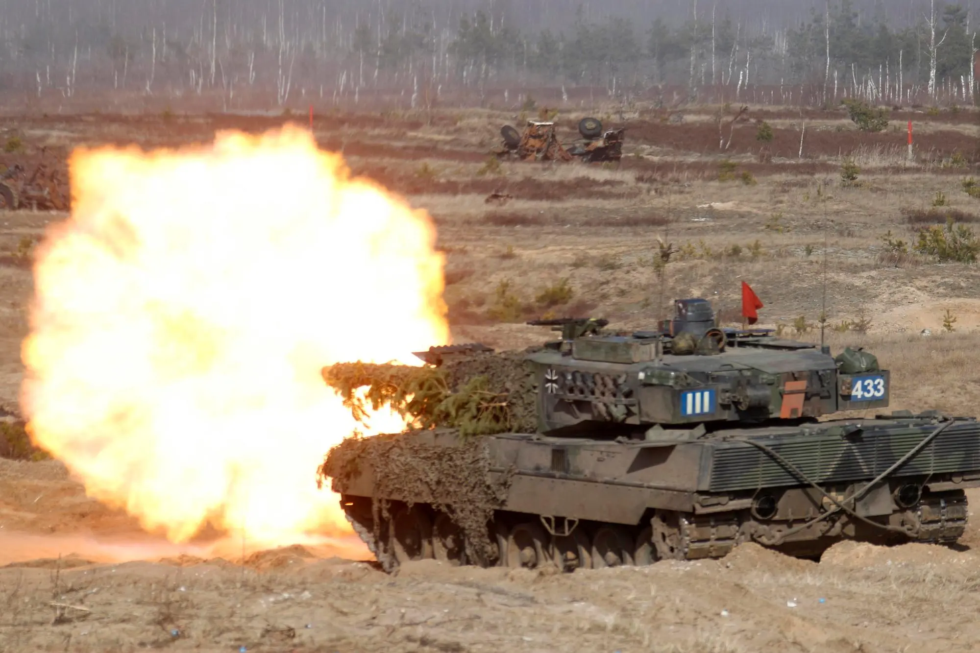 epa10427172 (FILE) - German soldiers of the NATO Extended Presence Battlegroup with their 'Leopard 2' battle tank participiate in the military exercise Crystal Arrow 2021 in Adazi Militari base, Latvia, 26 March 2021 (reissued 24 January 2023). German Chancellor Olaf Scholz has decided to send Leopard 2 tanks to Ukraine and allow other countries such as Poland to do so while the US may supply Abrams tanks, German media has reported 24 January 2023. EPA/VALDA KALNINA *** Local Caption *** 56789523