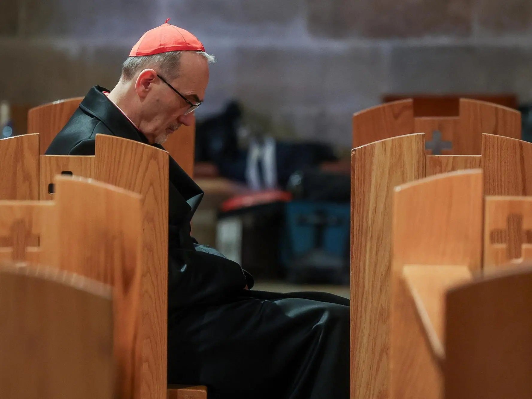 epa12858928 Cardinal Pierbattista Pizzaballa, the Latin Patriarch of Jerusalem, sits in the Church of All Nations on the day of a prayer service to mark Palm Sunday, in Jerusalem, 29 March 2026, following the cancellation of the traditional Palm Sunday procession from the Mount of Olives, amid restrictions on gathering in large groups and the US-Israeli conflict with Iran. EPA/Ammar Awad / POOL