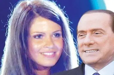 Ioana Claudia Amarghioalei con Berlusconi