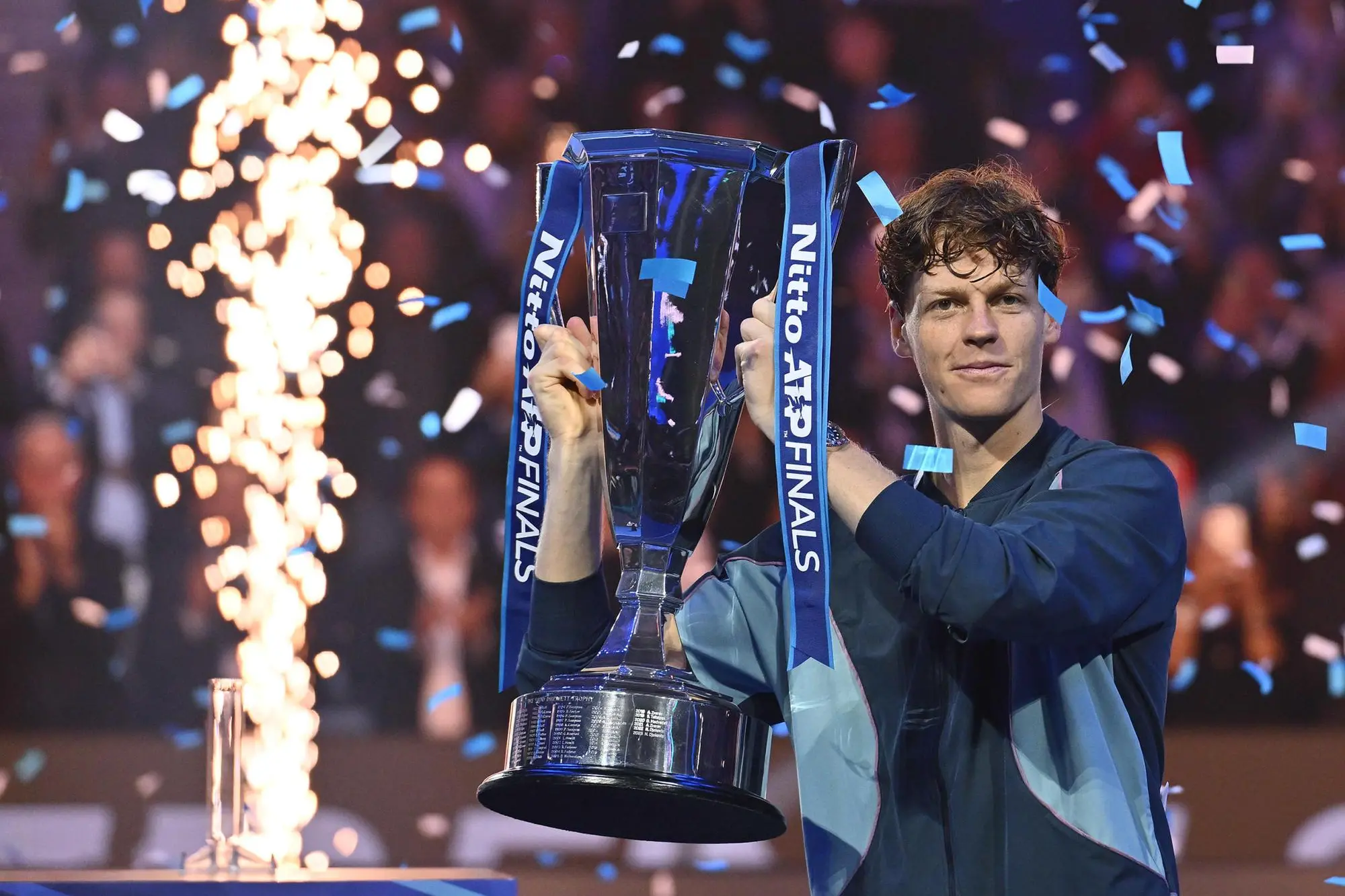 Italy's Jannik Sinner with the trophy after winning the final against USA's Taylor Fritz at the ATP Finals tennis tournament in Turin, Italy, 17 November 2024. ANSA/ALESSANDRO DI MARCO