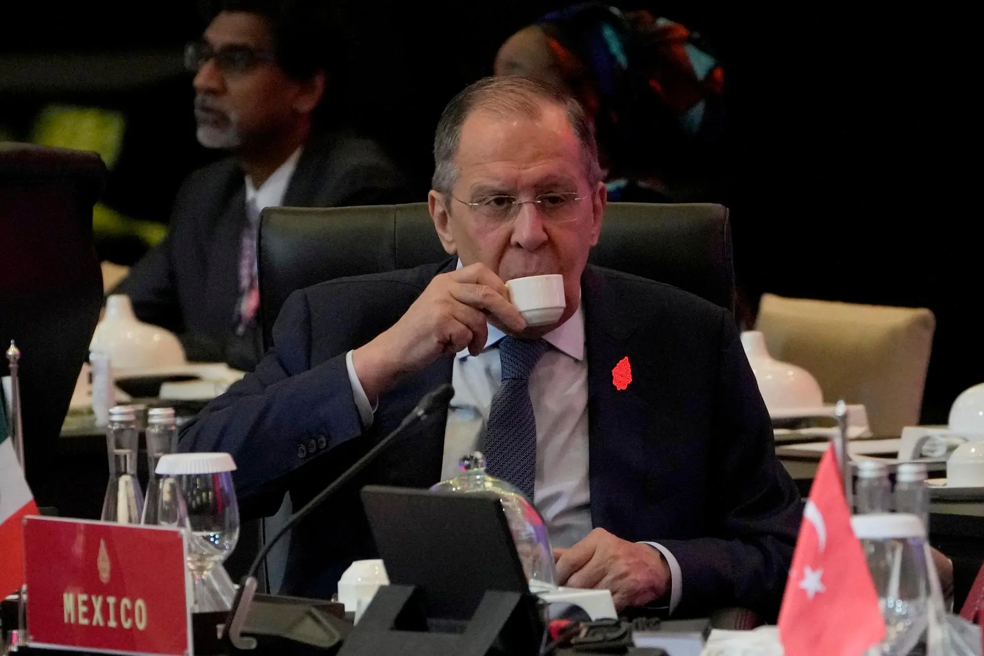 epa10058508 Russian Foreign Minister Sergey Lavrov sits in a meeting room before the start of the opening session of the G20 Foreign Ministers’ Meeting in Nusa Dua, Bali, Indonesia, 08 July 2022. Bali hosts the two-day G20 Foreign Ministers Meeting from 07 to 08 July 2022. EPA/DITA ALANGKARA / POOL