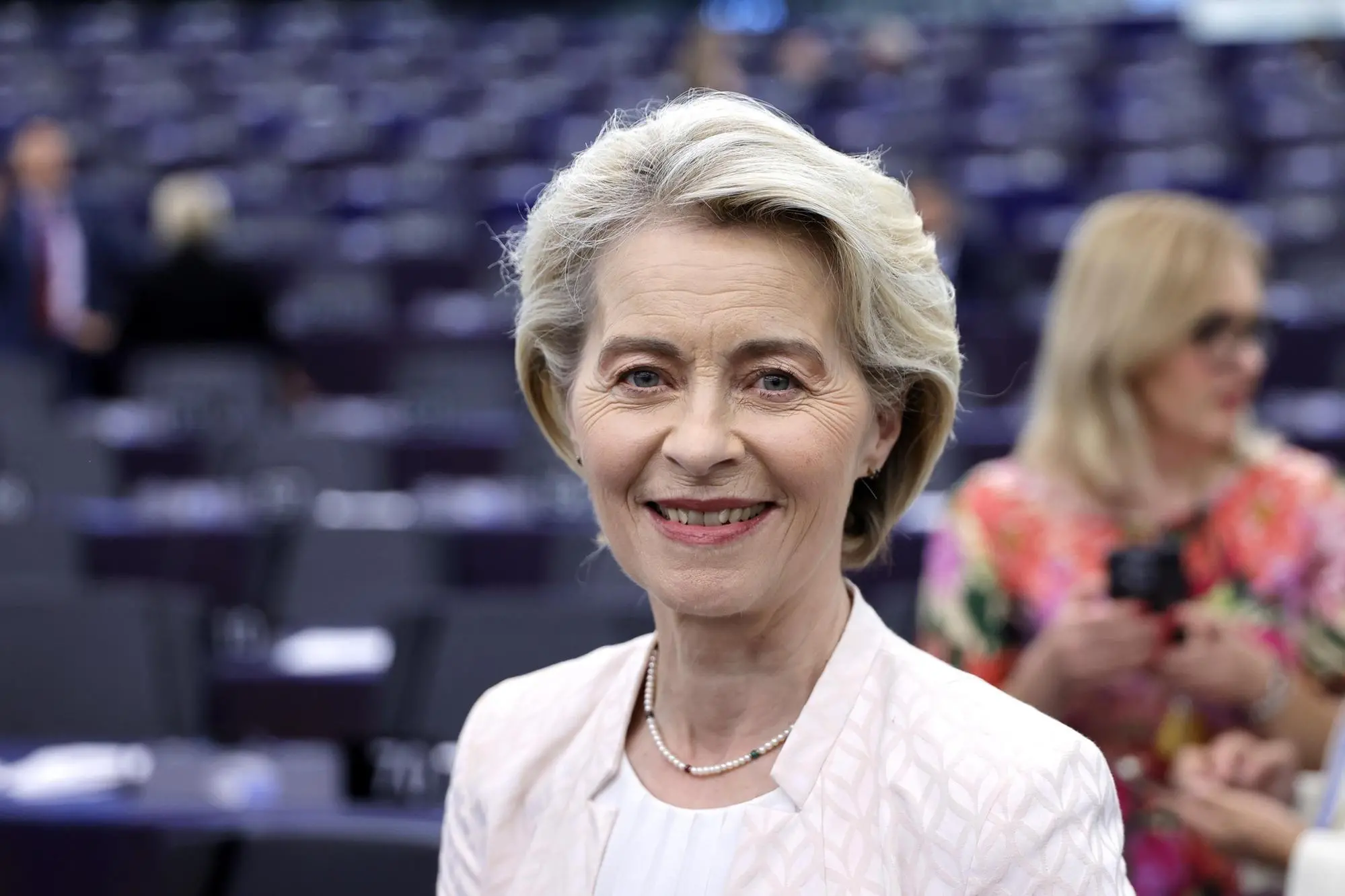 epa11485366 Ursula von der Leyen smiles after being re-elected as European Commission President during a plenary session of the European Parliament in Strasbourg, France, 18 July 2024. MEPs re-elected Von der Leyen as European Commission President for the next five years. EPA/RONALD WITTEK