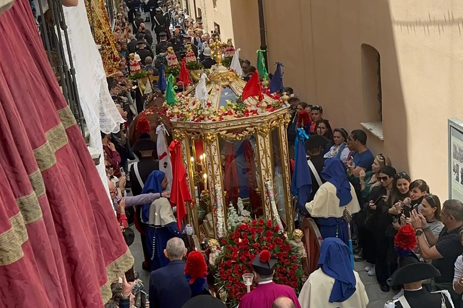 The Path Of Sant Efisio In The Midst Of A Crowd Of Thousands Of the-path-of-sant-efisio-in-the-midst-of-a-crowd-of-thousands-of