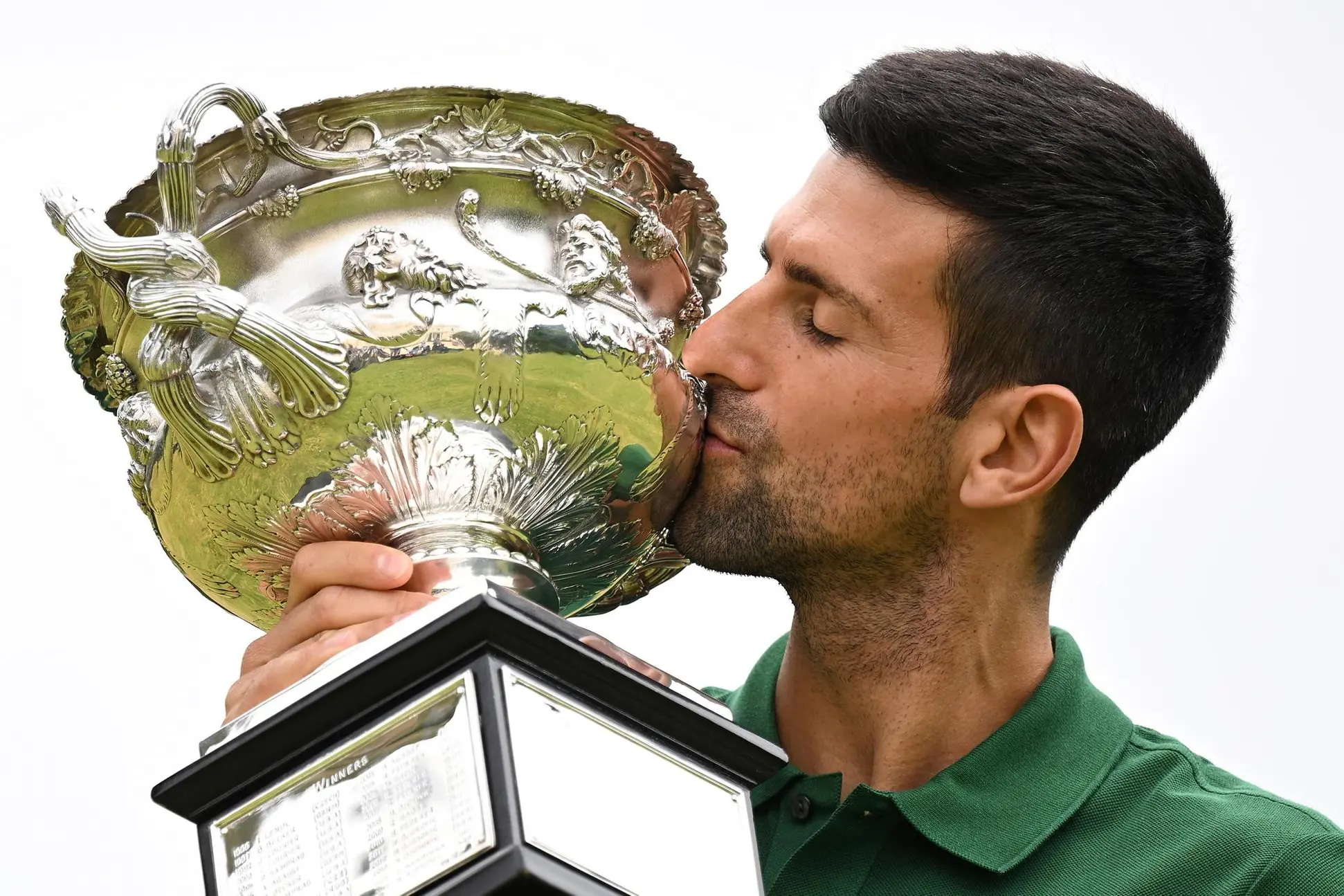 epaselect epa10439543 Novak Djokovic of Serbia poses with the Norman Brooks Challenge Cup following his win in the men's singles final in the 2023 Australian Open tennis tournament, at Government House in Melbourne, Australia, 30 January 2023. EPA/JAMES ROSS EDITORIAL USE ONLY AUSTRALIA AND NEW ZEALAND OUT